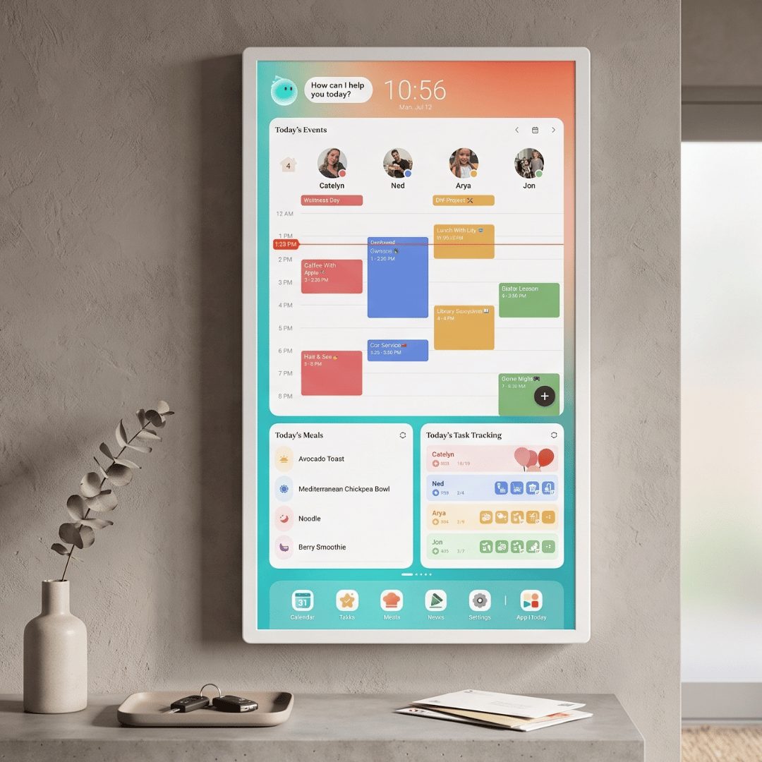 Cozyla Calendar touchscreen tablet mounted on a wall showing today's events, meals, and task tracking above a hallway console