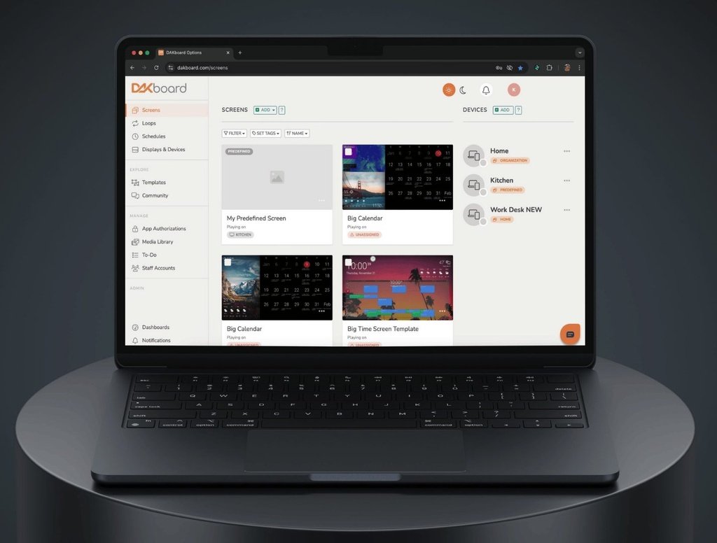 Drag-and-drop screen editor DAKboard screen-management dashboard open on a laptop with saved screen templates and connected home and kitchen devices