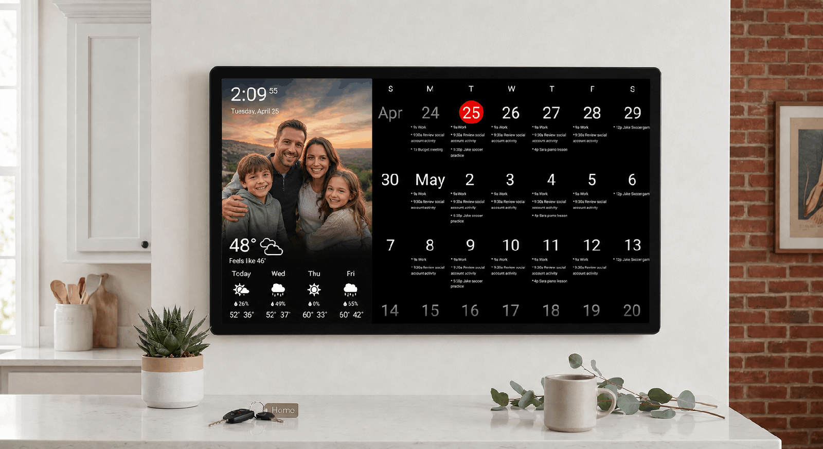 Family kitchen dashboard Wall-mounted widescreen DAKboard in a bright family kitchen showing a family photo, clock, weather forecast, and a month of events