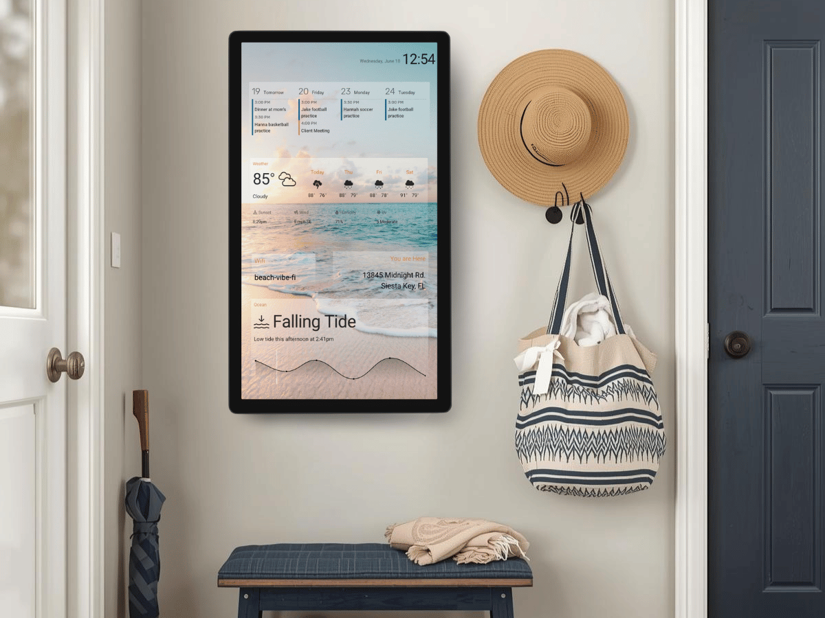 Entryway DAKboard showing the local weather forecast, current temperature, tide chart, and a coastal background photo